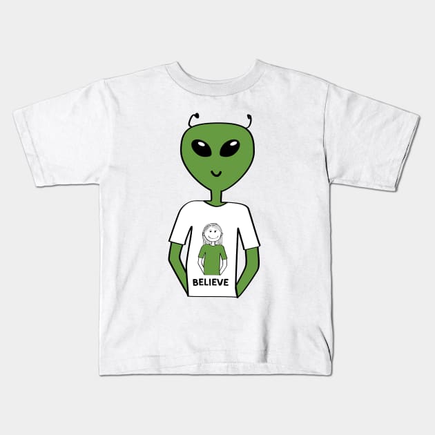 "Believe" T-shirt with Alien Wearing a T-shirt with a Human  (Girl) Kids T-Shirt by Markadesign